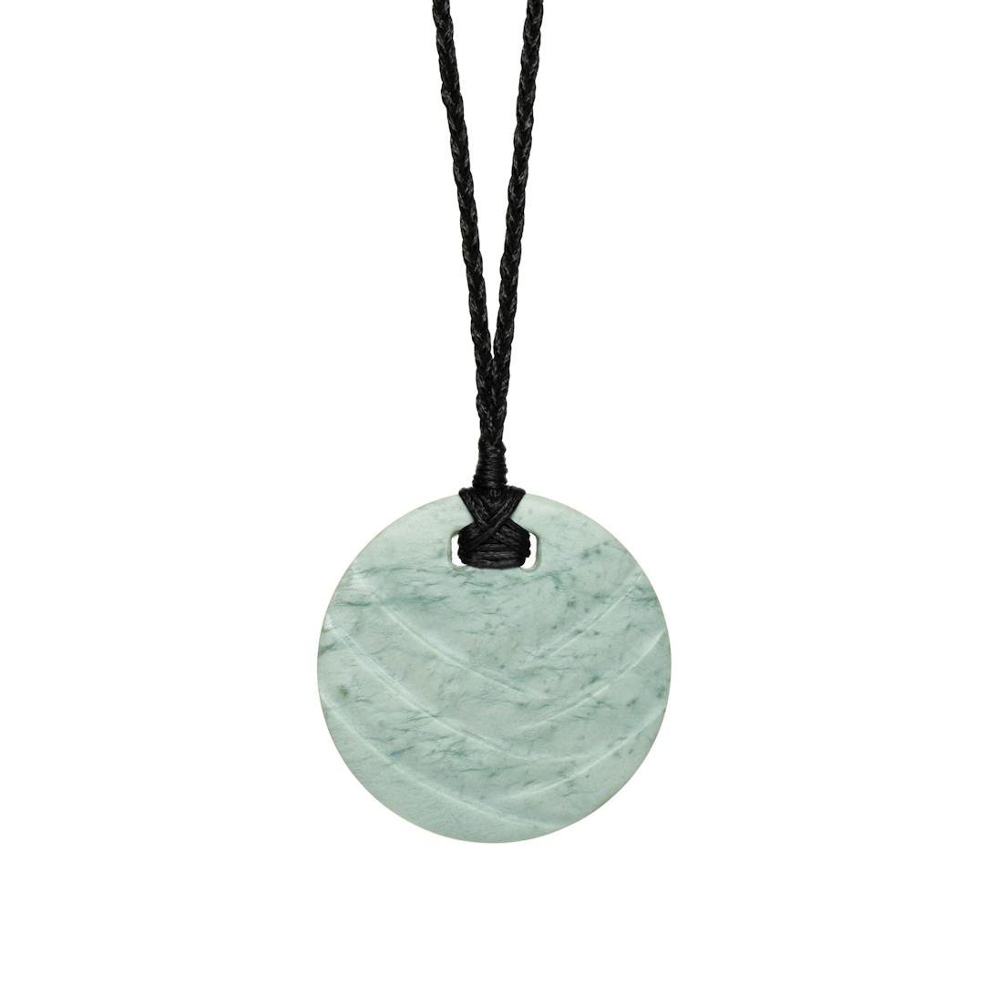 New Zealand Greenstone Disc with Inlaid Design