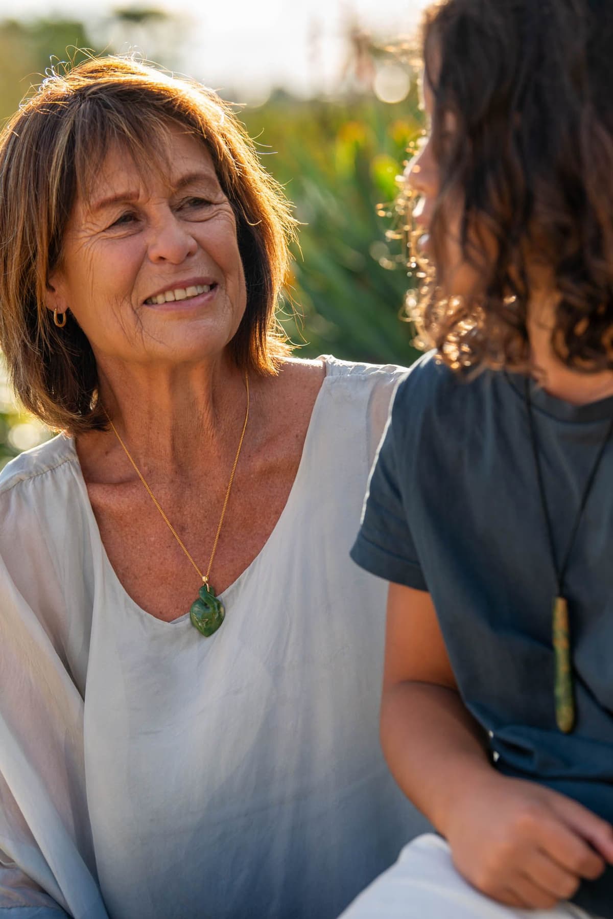 Contemporary Māori koru jewellery hand-carved from authentic New Zealand pounamu and finished with a silver setting, its flowing spiral form expressing growth, renewal and connection.