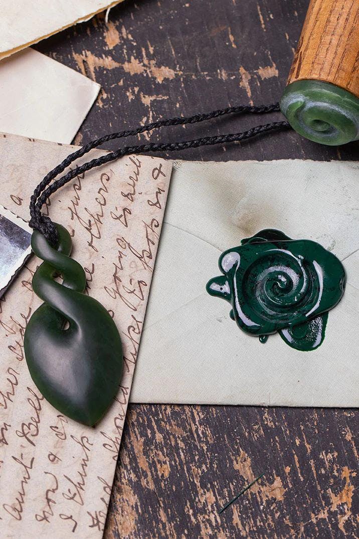 jade necklace and envelope with seal
